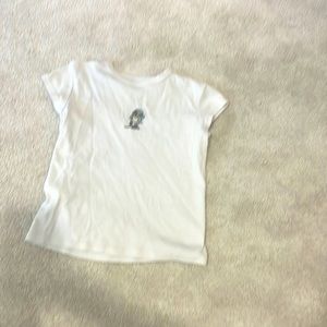White brandy Melville t shirt with skating penguin